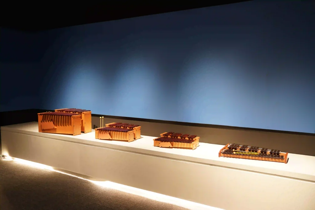 Display area featuring various Taiko drums and marimbas