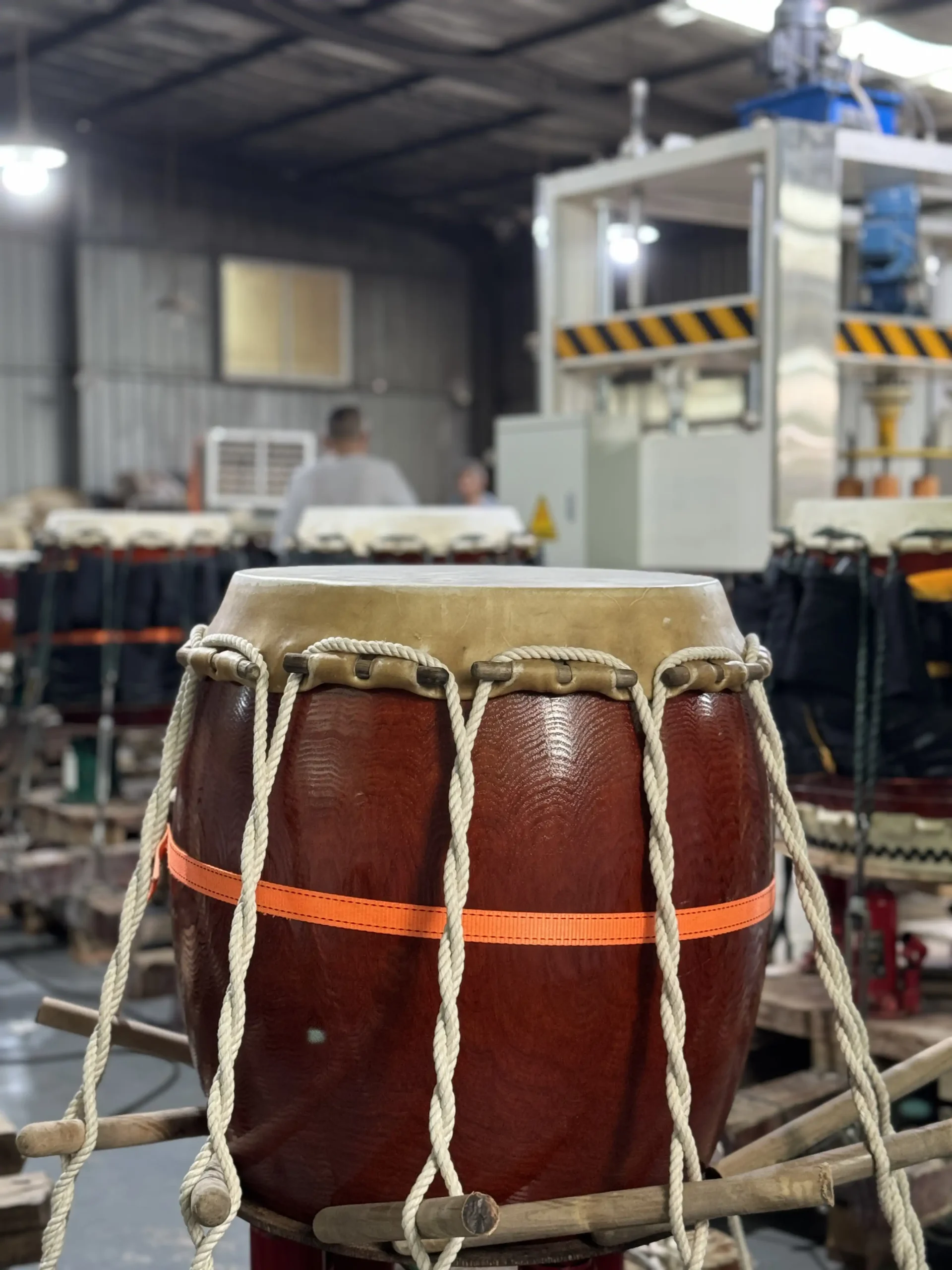 JINLEI craftsperson performing preliminary taiko skin stretching