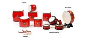 A collection of traditional Japanese Taiko drums featuring red O-Daiko, Hira-Daiko on a stand, Okinawa Eisa-Shimedaiko with red ropes, and small Palanku hand drums with bachi drumsticks.