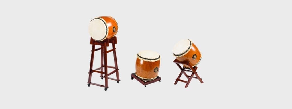 A collection of three JINLEI Nagado Daiko taiko drums showcasing different types of wooden stands