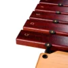 JINLEI box xylophone low pitch BXL-16 close-up of C D E F rosewood keys with gold engraved note labels and brass pin mounts on natural wood frame