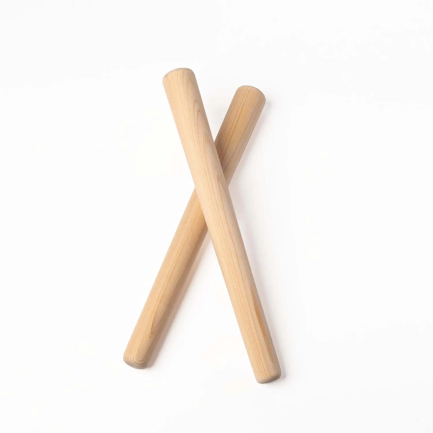 JINLEI hinoki tapered bachi for nagado taiko - two natural hinoki cypress drumsticks crossed in X shape showing tapered design