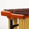 JINLEI marimba MLP-52 close-up of polished cherry wood side rail, rosewood bars, gold anodized resonator tubes, and height adjustment mechanism