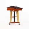 JINLEI marimba MLP-52 side view from low end showing rosewood bars, large gold resonator tubes, cherry wood frame, and tripod caster base