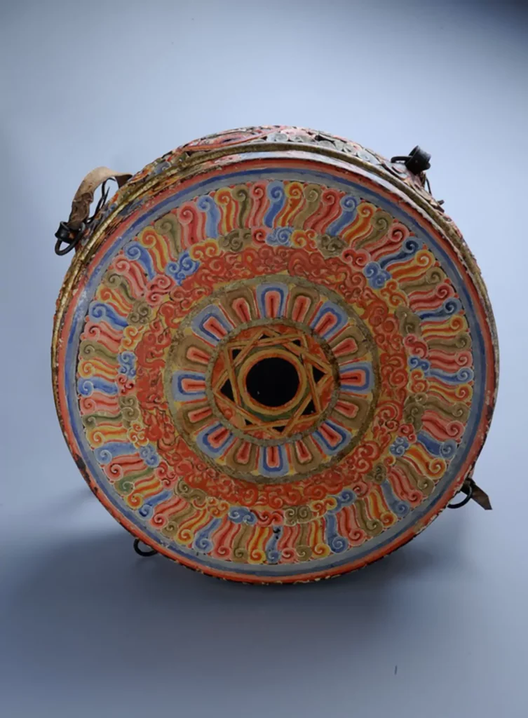 Exquisitely painted traditional Taiko drum surface featuring intricate ancient patterns, symbolizing the wisdom of master craftsmen passed down through generations.
