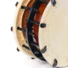 Close-up of JINLEI 2Cyoukake Shime Daiko bolt drum showing stitched leather drumhead rim, black metal hoop with threaded bolt and nut tension hardware with leather washers against amber lacquered wood shell