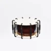 JINLEI 2Cyoukake Shime Daiko Turnbuckle drum front view showing natural cowhide drumhead with stitched leather rim, evenly spaced black metal turnbuckle tension system with U-shaped hooks and deep amber lacquered wood shell