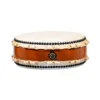 JINLEI Hira Daiko Keyaki drum front view showing flat wide-body design with cowhide drumhead, black bead tacking, rawhide lacing and reddish-brown keyaki wood shell with ornate gold hardware