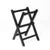 JINLEI Hira daiko X Stand front angle view showing black lacquered folding wood frame with X-shaped cross-leg base, horizontal support rails and black non-slip fabric drum cradle straps