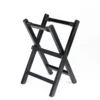 JINLEI Hira daiko X Stand side angle view showing black lacquered folding wood frame with X-shaped cross-leg base, metal pivot hardware and black non-slip fabric drum cradle straps