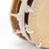 Close-up of JINLEI Namitsuke Shime Daiko drum showing hand-stitched leather drumhead rim, thick white twisted rope tension lacing with knotted ties against amber wood shell