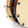 Close-up of JINLEI Namituke Shime Daiko bolt drum showing stitched leather drumhead rim, black metal hoop with threaded bolt tension hardware and leather washers against amber lacquered wood shell
