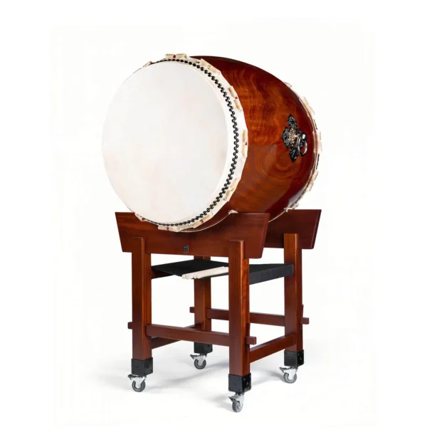JINLEI O-Daiko Akatsuki Series full view showing large taiko drum with cowhide drumhead and black bead tacking mounted on mahogany yagura tower stand with caster wheels and drumsticks