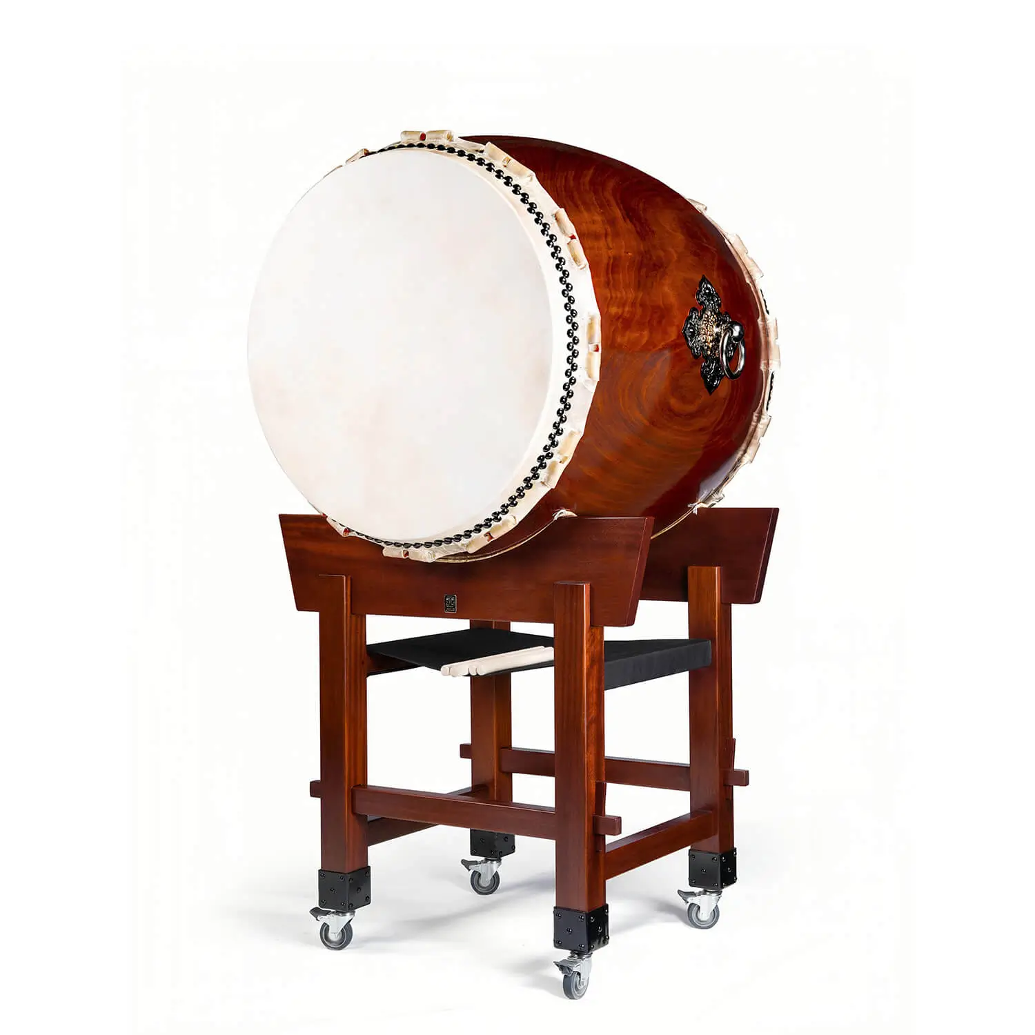 JINLEI O-Daiko Akatsuki Series full view showing large taiko drum with cowhide drumhead and black bead tacking mounted on mahogany yagura tower stand with caster wheels and drumsticks