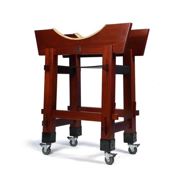 JINLEI O-Hira Daiko Tower Stand full view showing heavy-duty mahogany wood frame with wide curved drum cradles, rope padding, black studded metal corner brackets and lockable swivel caster wheels