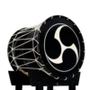 JINLEI O-Shime daiko, glossy black shell with white rope tuning and tomoe pattern drumhead on black stand, side angle view