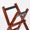 JINLEI shime daiko x stand close-up detail, felt-padded support bars and bolt pivot joint on cherry wood frame