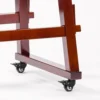 Close-up of JINLEI Yagura Tower Stand for Nagado Daiko base showing mahogany wood frame joints and black lockable rubber caster wheels for easy mobility