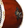 Close-up of O-Daiko Kapiac Do Series drum shell showing black iron diamond-shaped hardware with gold and silver ring pull against smooth deep reddish-brown kapiac wood surface